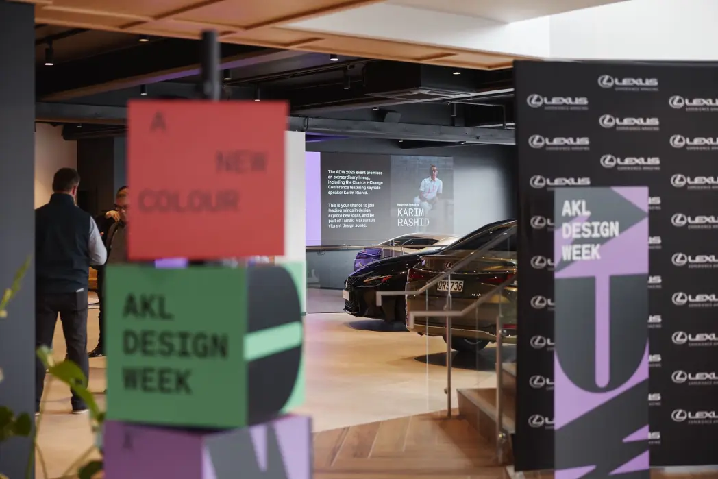 AKL design week, room showcasing cars and sponsors